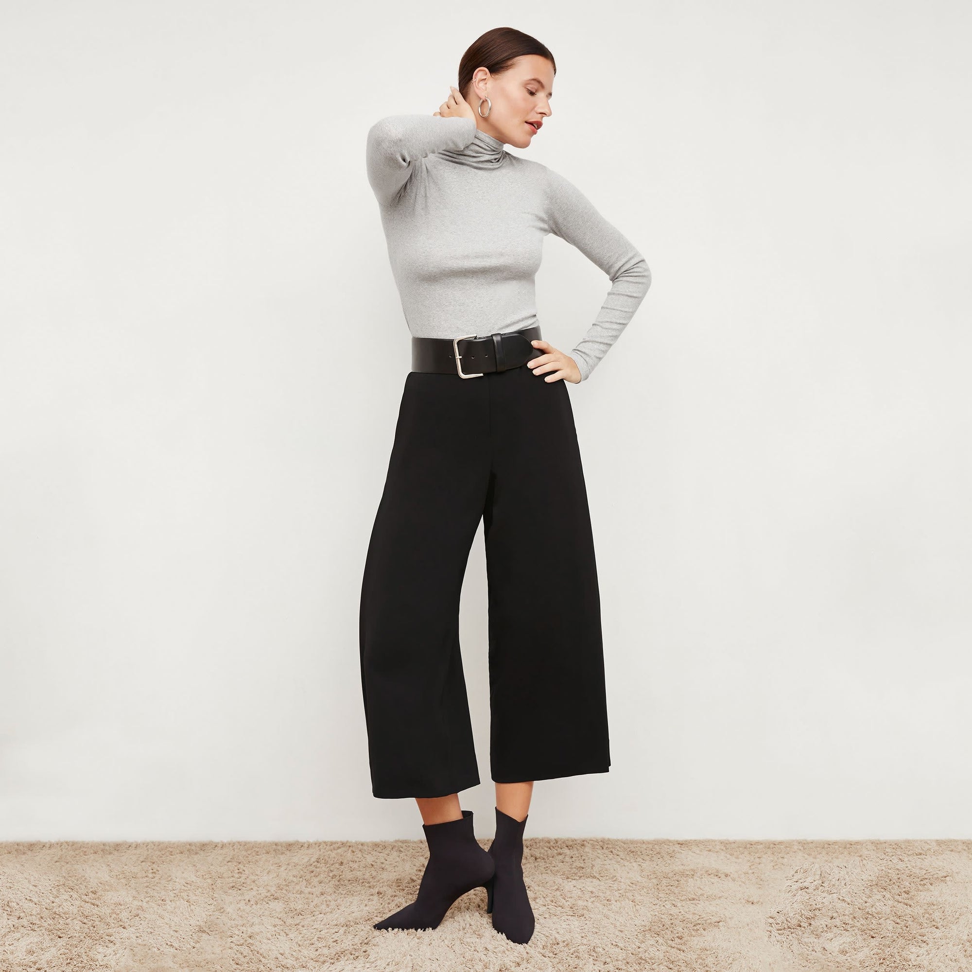 Front image of a woman standing wearing the Zhou culotte in black | Exclude