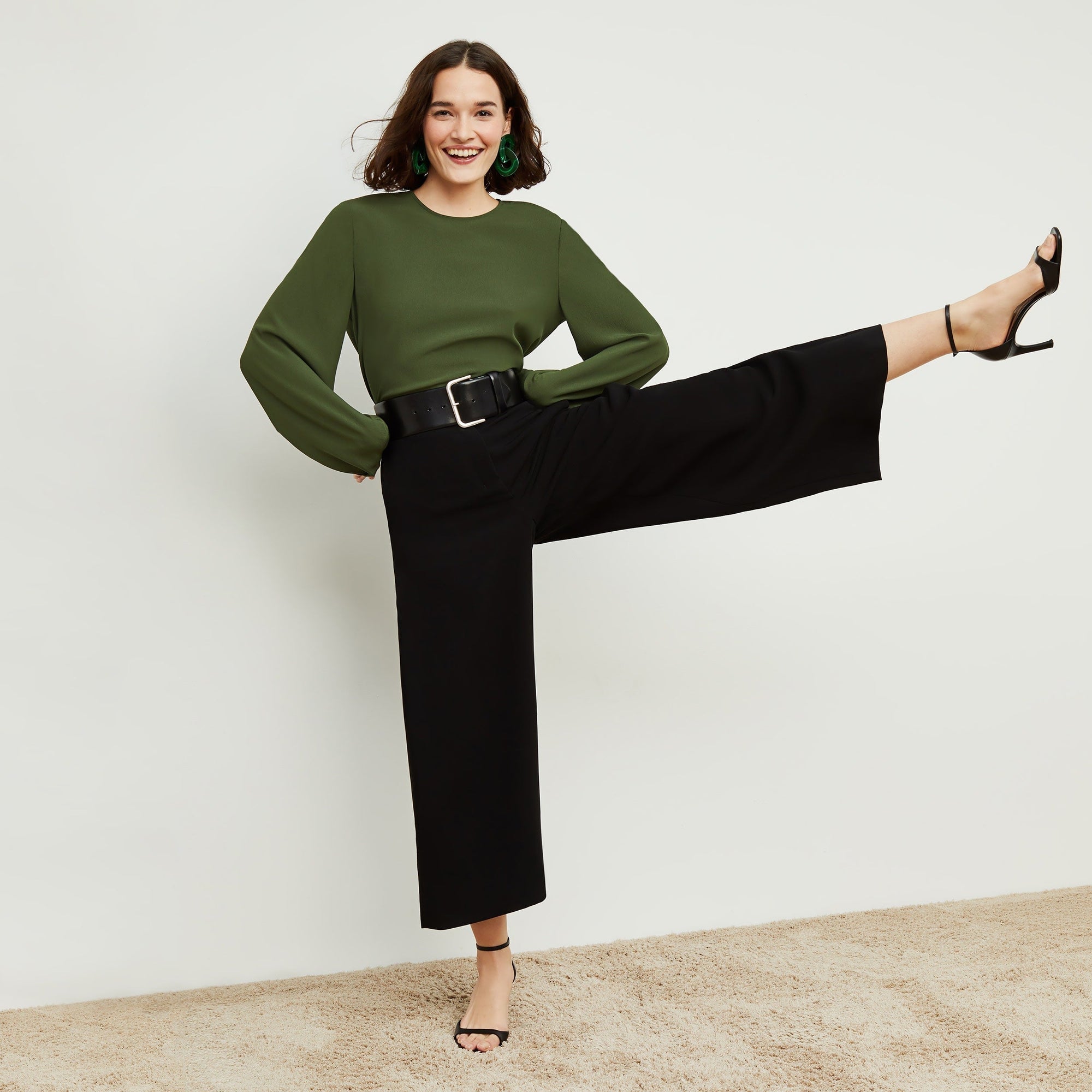 Front image of a woman standing wearing the Zhou culotte in black | Exclude