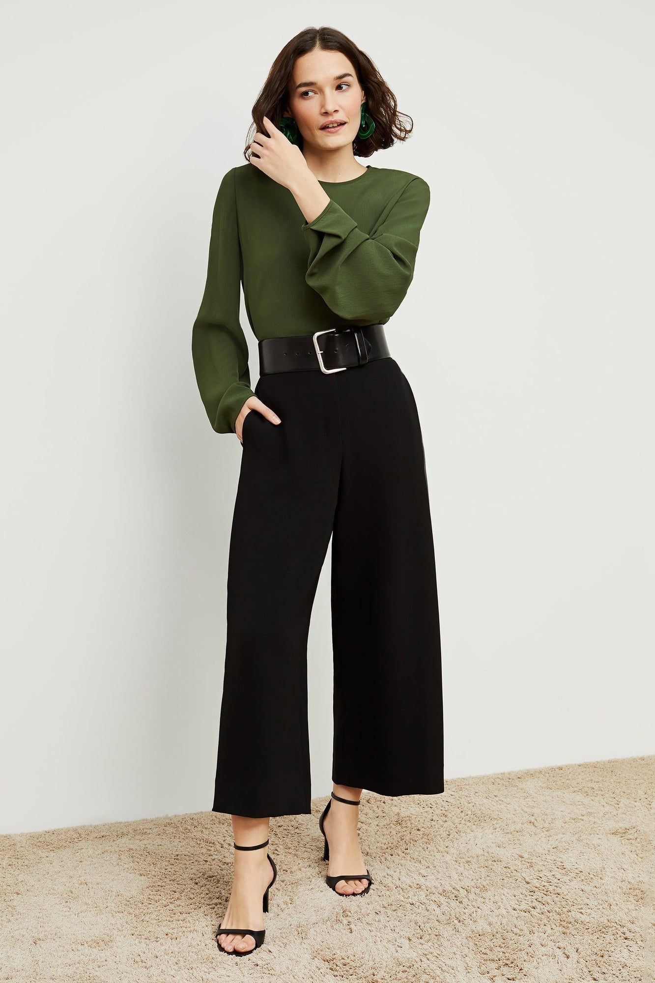 Front image of a woman standing wearing the Zhou culotte in black | Exclude