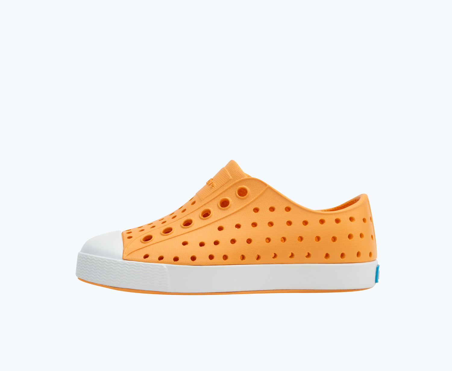 Side view of a Native Shoes Kids Jefferson Kids | Papaya Orange/ Shell White Footwear