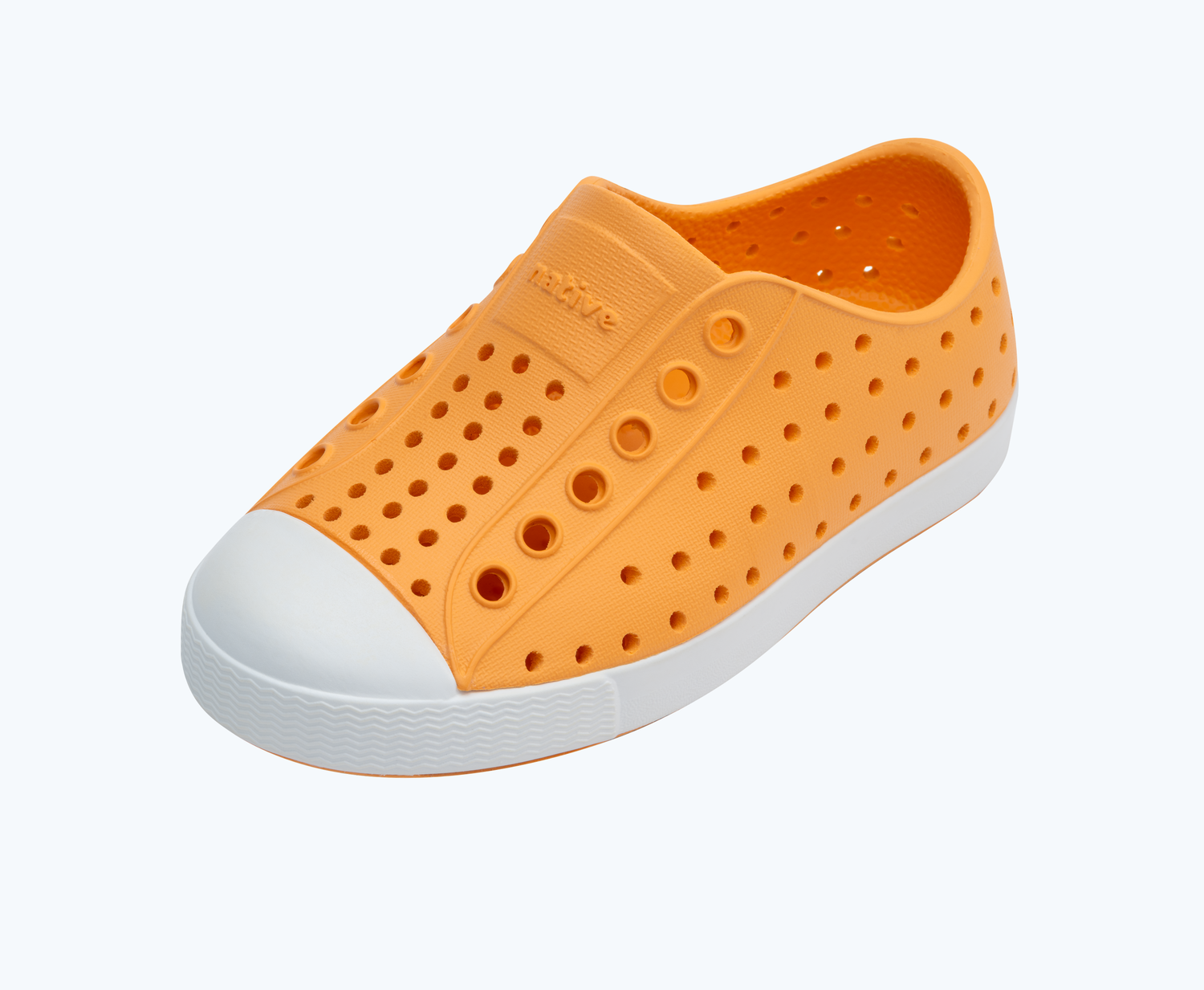 Angled view of a Native Shoes Kids Jefferson Kids | Papaya Orange/ Shell White Footwear