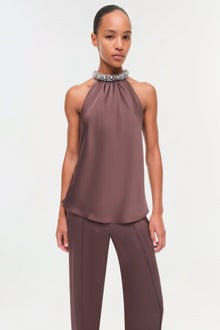 Mauve satin halter top with crystal embellished neckline and relaxed fit.