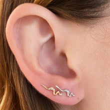 14K yellow and white gold Demi Pavé Small Ripple Climber Earring styled together on an ear