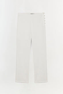 White straight leg trouser with button side closure and flat front waistband.