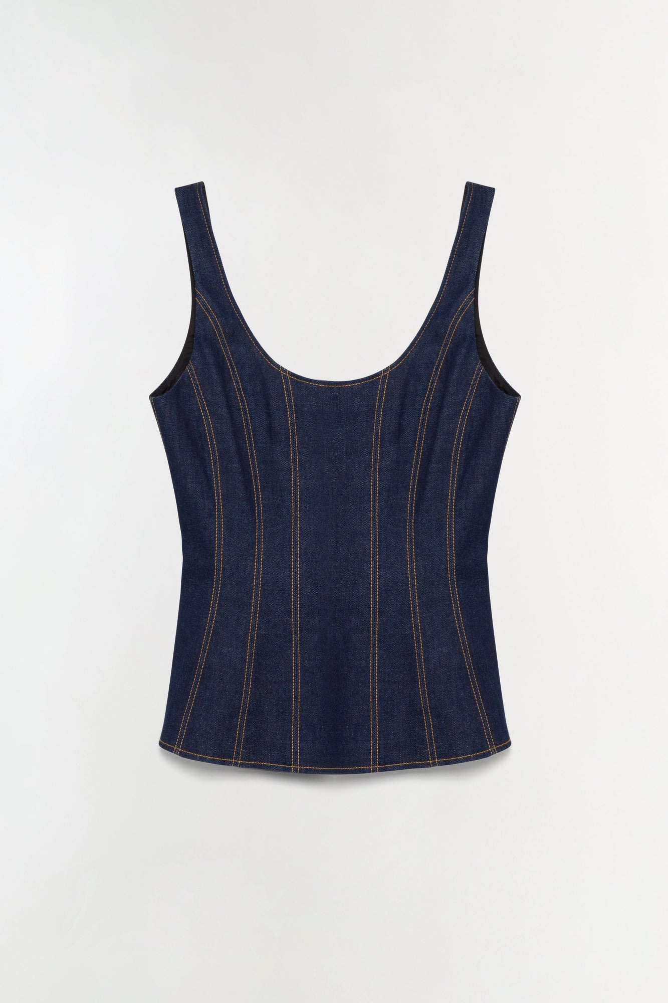 Dark blue denim bustier top with contrast topstitching and curved neckline on neutral background.
