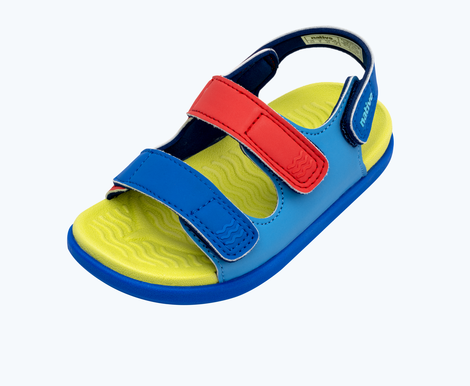 Angled view of a Native Shoes Kids Frankie Sugarlite Kids | Resting Blue/ Celery Green/ Uv Blue/ Uv Hyper Strap Footwear