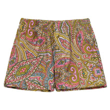 Swim trunks with multicolored paisley pattern featuring pink, gold, green, and blue swirls and decorative details.