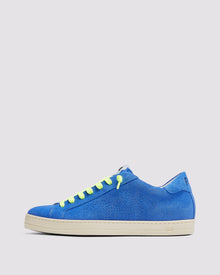 Side angle of the left blue sneaker with yellow laces and right orange sneaker with purple laces