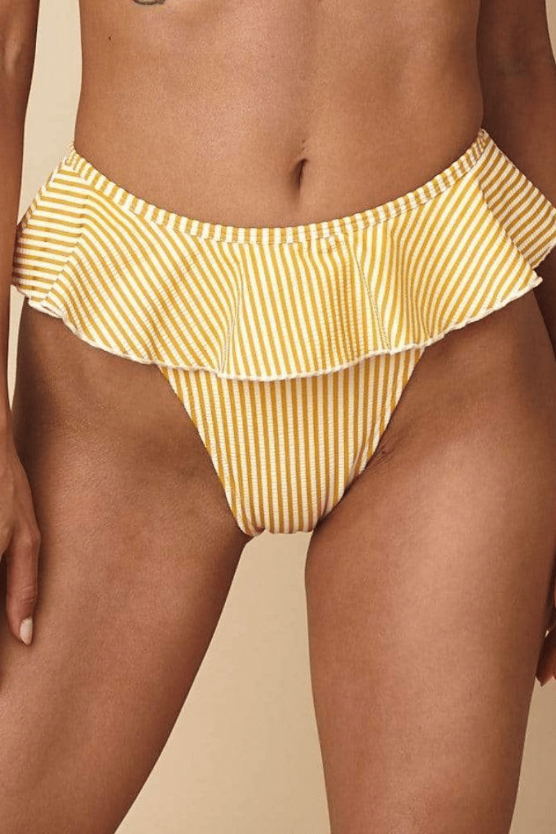 Yellow and white striped bikini bottom with ruffled waistband and leg openings.