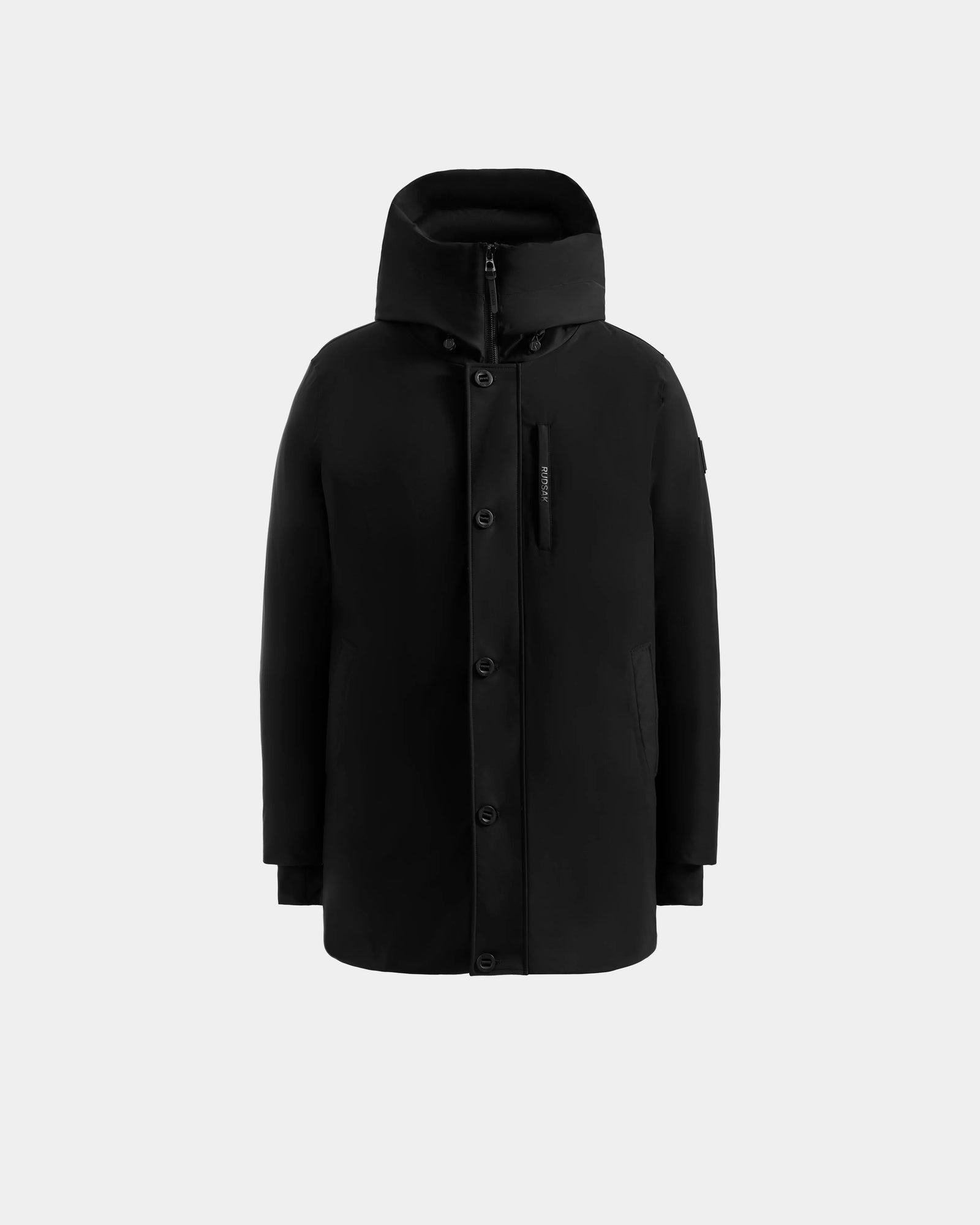 The Rudsak COREY - M125512 Black is a hooded winter jacket with front button closure, left chest zipper pocket, and two side pockets, made with RDS-certified down, shown against a plain light gray background.
