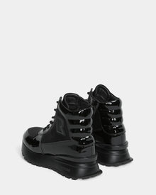 The Rudsak CHELSA - L224505 Black womens sneaker boots feature a waterproof zipper for easy wear—stylish, weather-resistant footwear for any occasion.