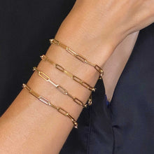14k gold Chunky Paperclip Chain Bracelet with a lobster clasp styled on a wrist