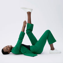 side image of a woman wearing the janette jacket in shamrock 