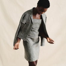 front image of a woman wearing the jennifer dress in black/ivory