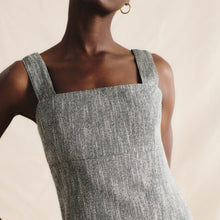 front image of a woman wearing the jennifer dress in black/ivory