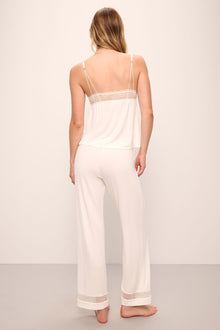 Model wears Mia TENCEL Modal Cami & Pant PJ Set in Ivory.