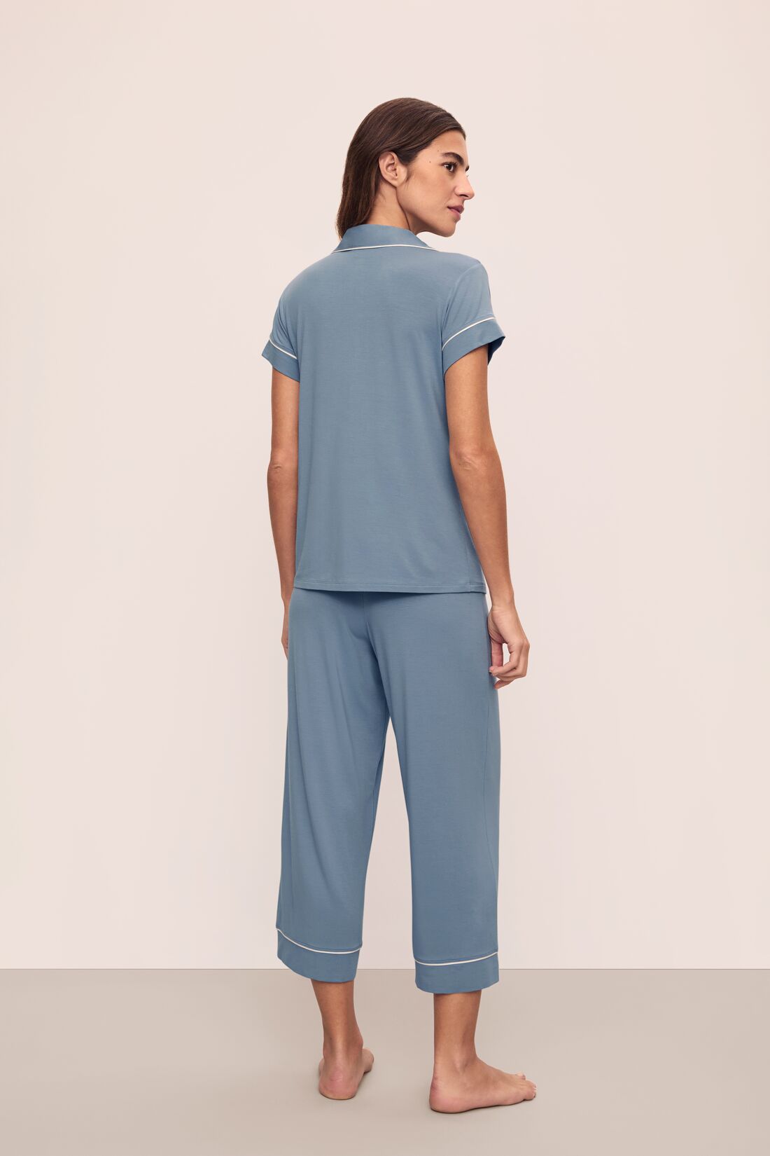 Model is wearing Gisele TENCEL Modal Short Sleeve Cropped PJ Set in Faded Denim/Ivory