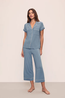 Model is wearing Gisele TENCEL Modal Short Sleeve Cropped PJ Set in Faded Denim/Ivory