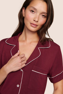 Model is wearing Gisele TENCEL Modal Relaxed Short PJ Set  in Bordeaux/Ivory