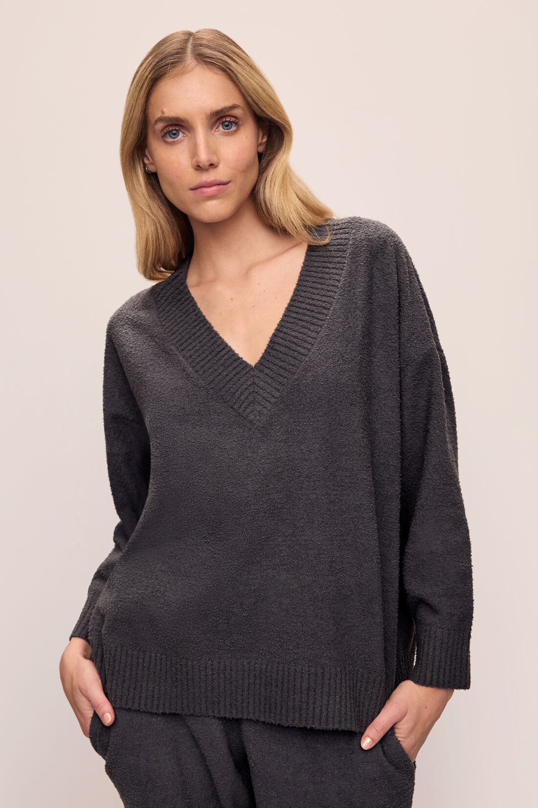 Model wears Recycled Boucle Boyfriend Oversized V-Neck Sweater in Graphite.