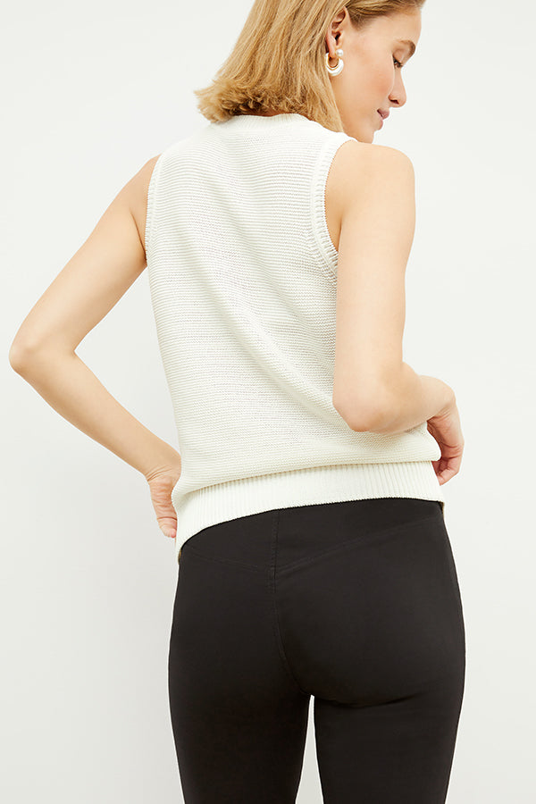 Front image of a woman standing wearing the Foster Pant—Everstretch in Black | Exclude