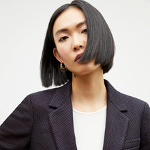 Front image of a woman wearing the yiyan blazer in navy multi