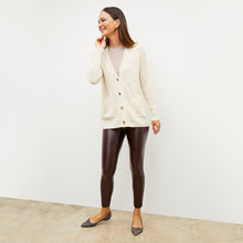Front image of a woman wearing the harrington in brown