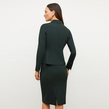 Image of a woman wearing the Chantal Skirt - Light Scuba in Forest
