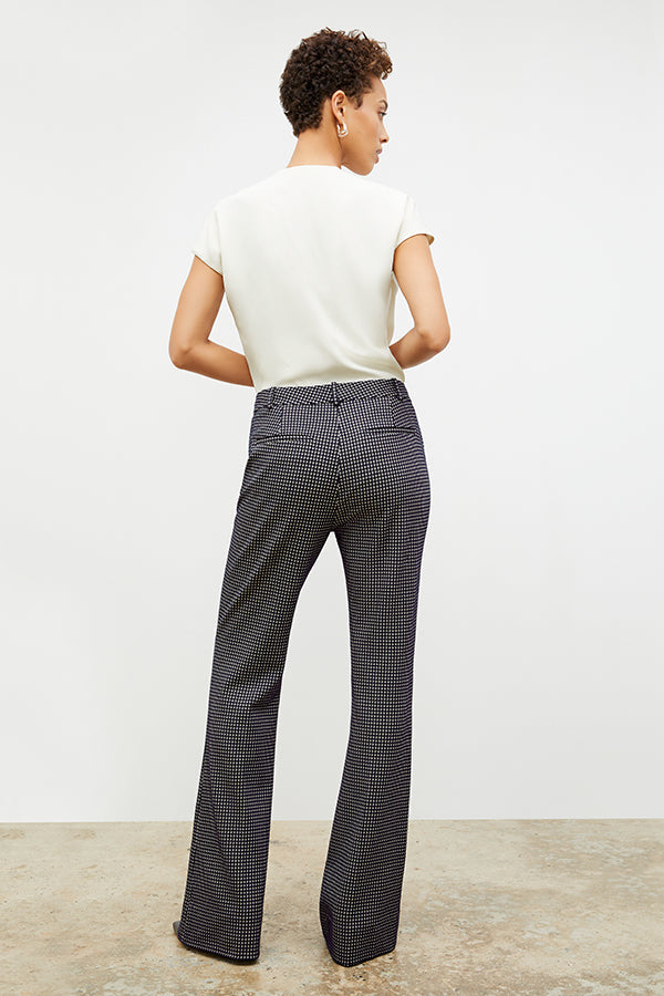 Back image of a woman wearing the horton pant in black and white houndstooth | Exclude