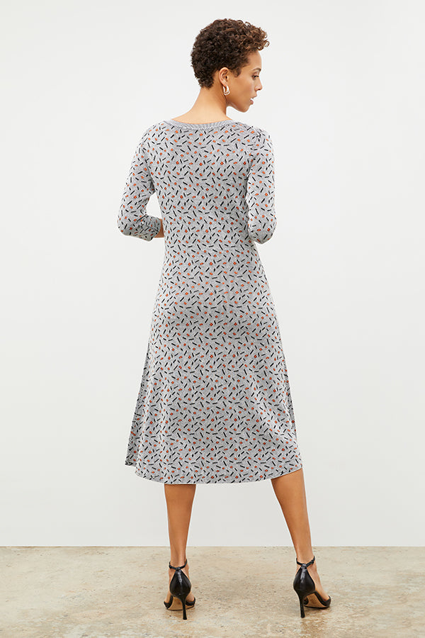 Back image of a woman wearing the Tippy Dress in Brick and Black | Exclude