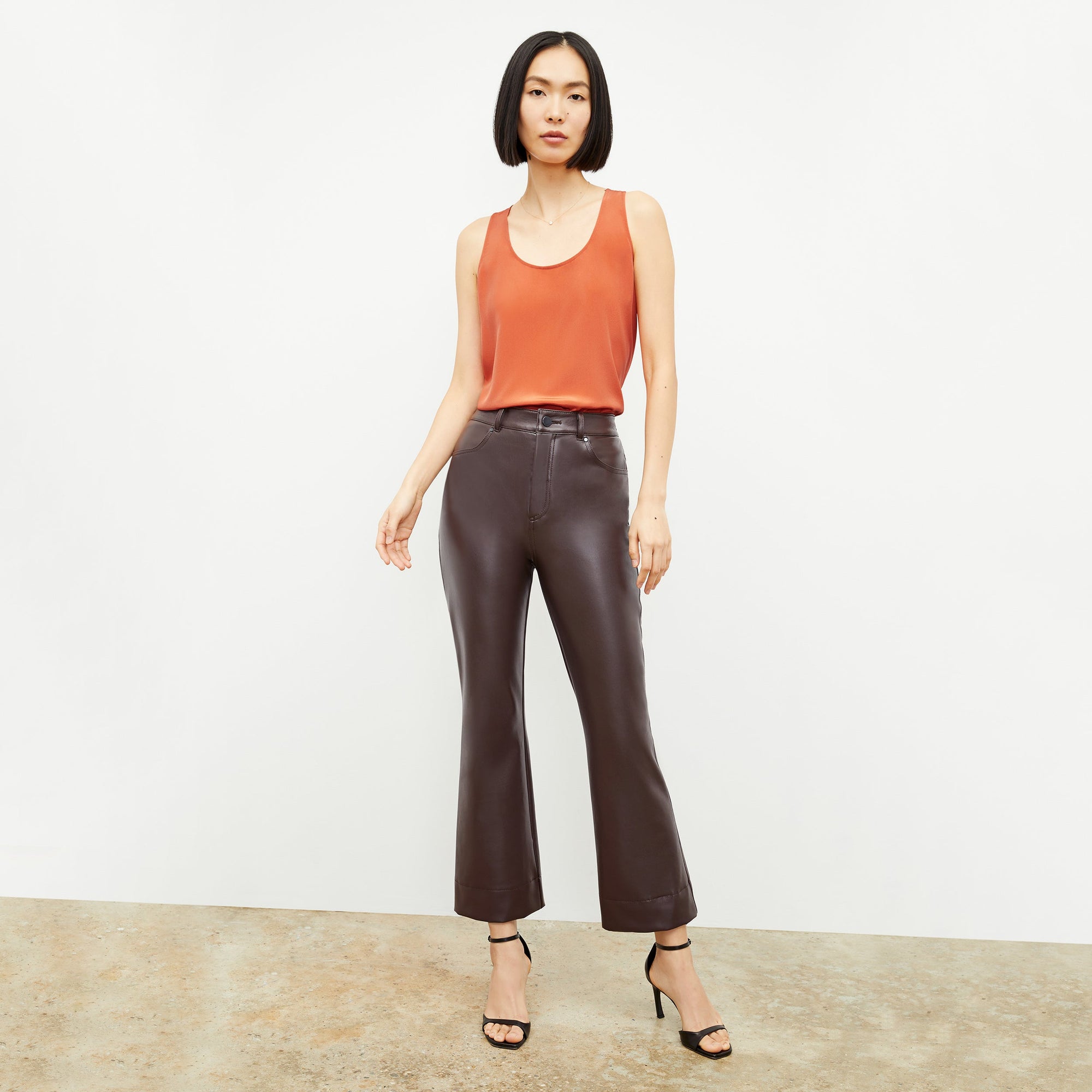 Front image of a woman wearing the archie pant in brown