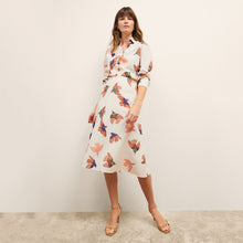 front image of a woman wearing the orchard skirt in hummingbird print
