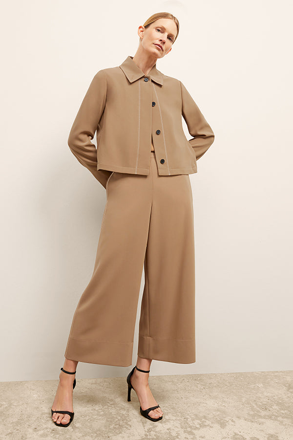 front image of a woman wearing the nicky jacket in saddle | Exclude | Grid Hover