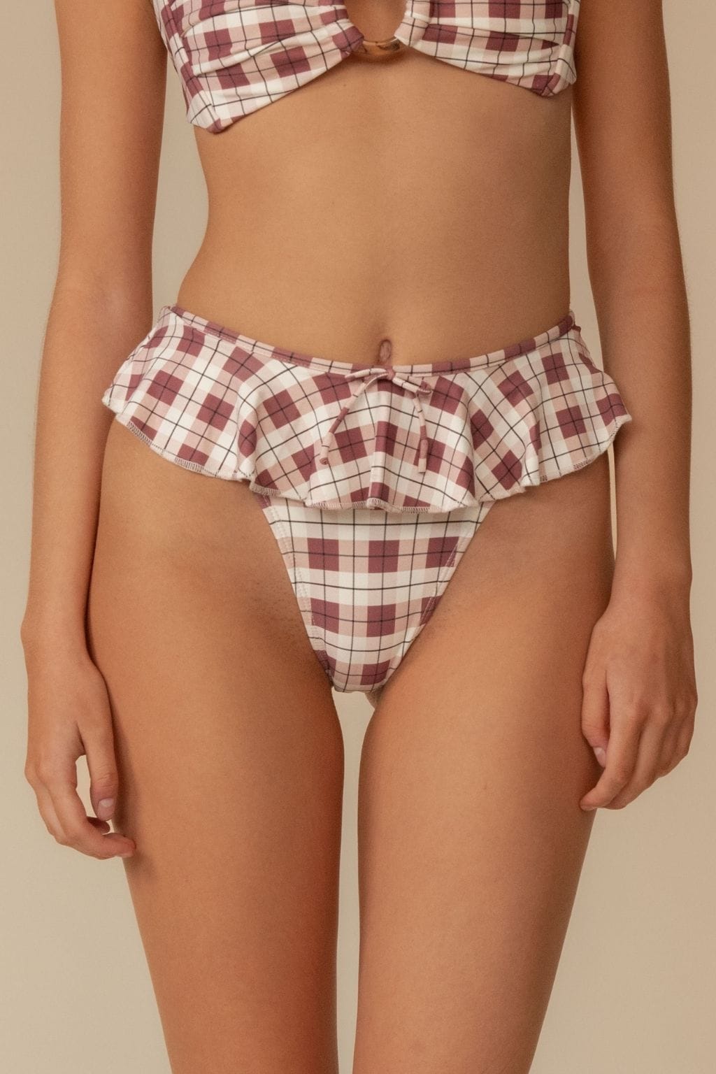 Maroon and cream plaid bikini bottom with ruffled waistband and drawstring tie.