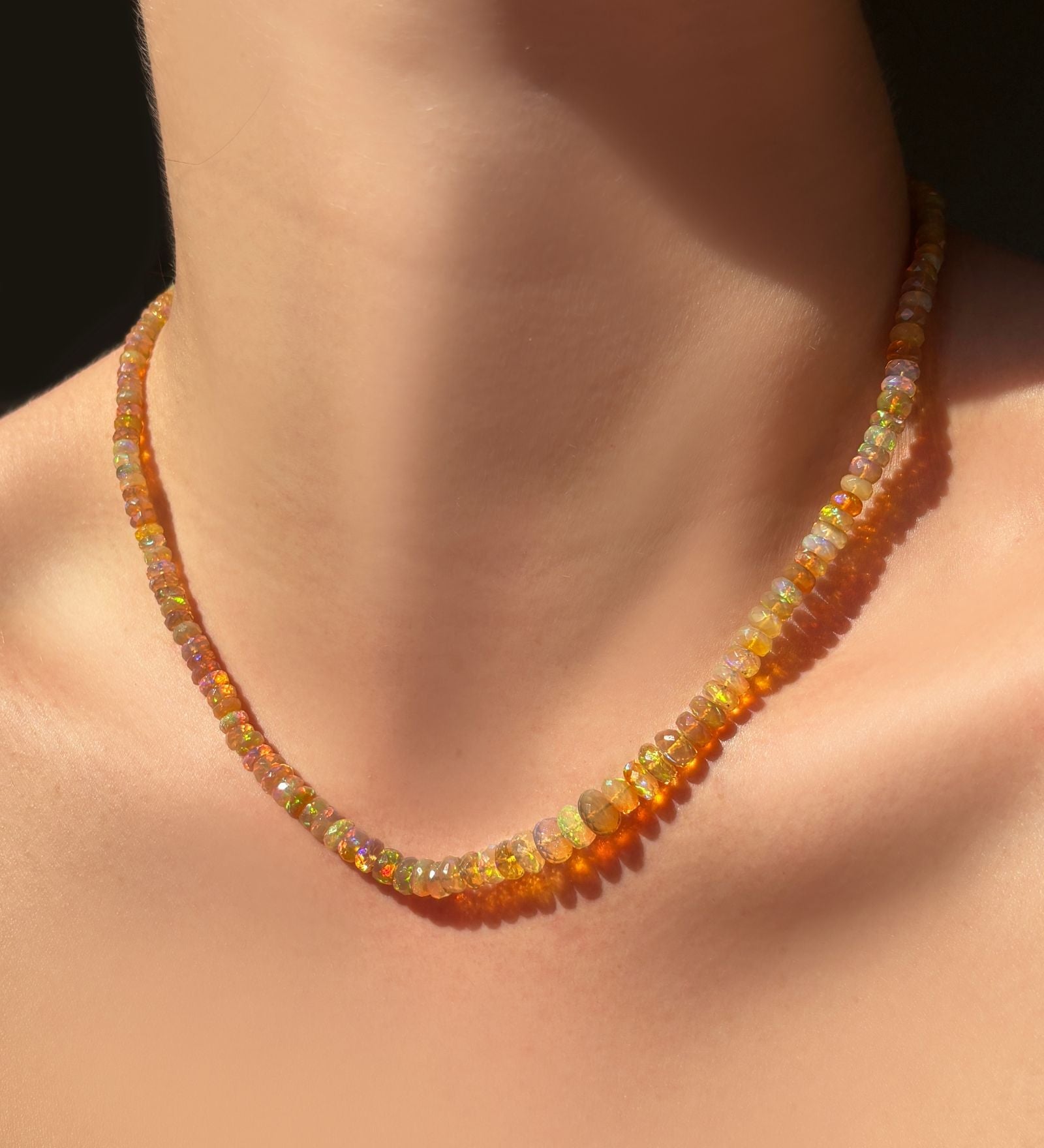Mercury in Retrograde Faceted Opal Necklace hanging on the neck.