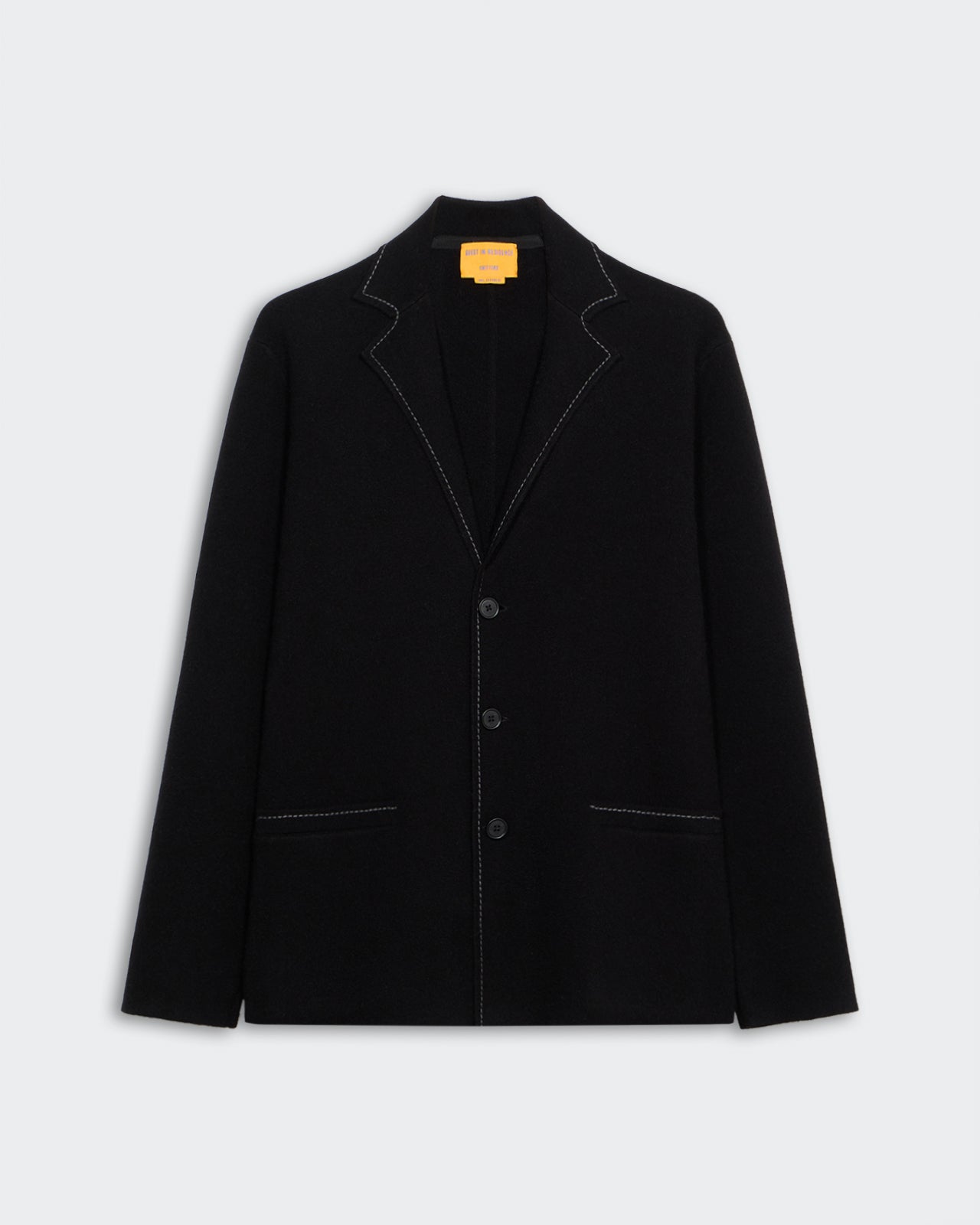 Off Duty Blazer - Black displayed flat, featuring three buttons and contrast white stitching on lapels and pockets.
