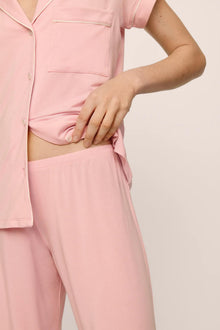Model is wearing Gisele TENCEL Modal Short Sleeve Cropped PJ Set in  Silver Pink/Ivory