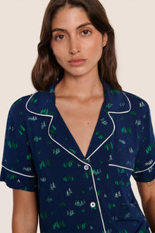 Model is wearing Gisele Printed TENCEL Modal Relaxed Short PJ Set  in Forest Pine Navy/Ivory