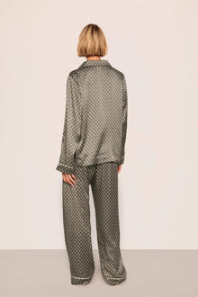 Model is wearing Inez Washable Silk Printed Long PJ Set  in Petite Batik Smokey Olive/Ivory
