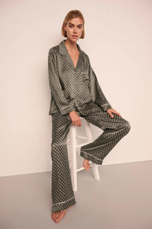Model is wearing Inez Washable Silk Printed Long PJ Set  in Petite Batik Smokey Olive/Ivory