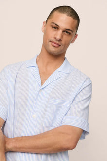 Model is wearing Men's Nautico Short PJ Set in White/CornflowerBlue