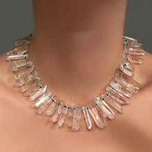 Rock crystal collar on a model's neck.