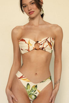 Cream bikini bottom with red and yellow floral print and zig-zag stitching detail.