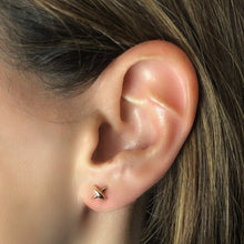 14k gold Stitch Stud Earrings on an ear