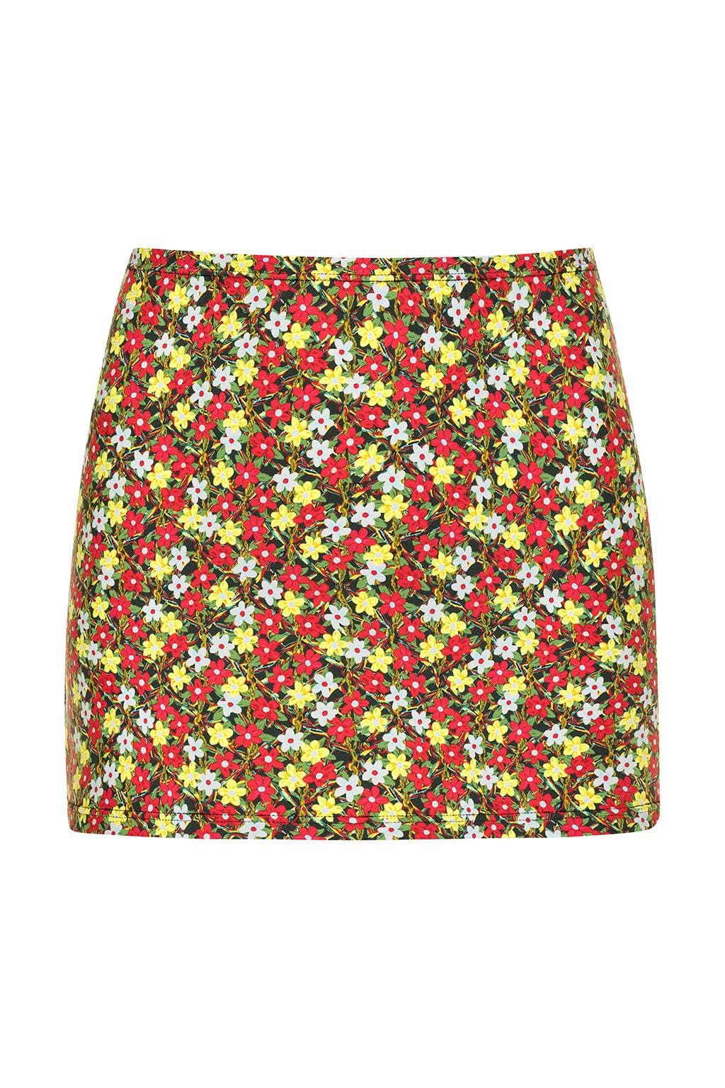 Mini skirt with red, yellow, and white floral print on dark background.