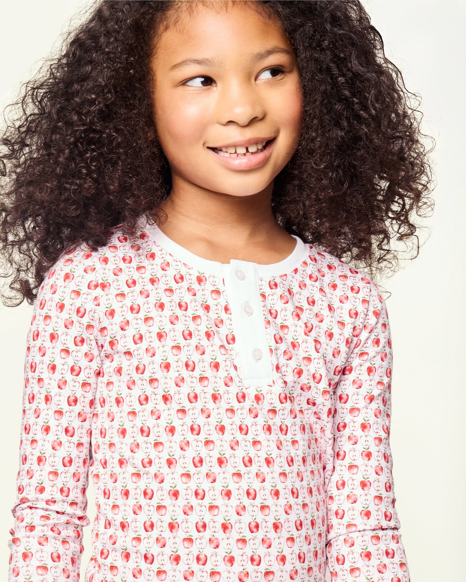 Kid's Pima Snug Fit Pajama Set in Autumn Orchards: two-piece set with long sleeves and pants, featuring a red flower pattern on a white background with solid white cuffs and neckline.