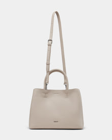 The Rudsak CATIRA S - 8325006 Vanilla women’s tote bag features beige pebble leather, a minimalist design, two short handles, a removable long strap, and a small metallic logo on the front.