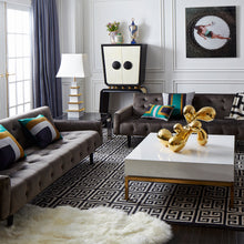giant brass orb peking cocktail table living room - styled view