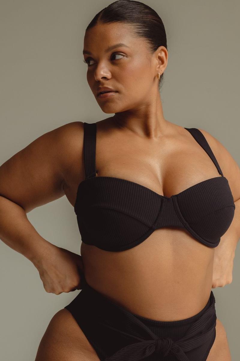 Black ribbed bikini top with sweetheart neckline and adjustable shoulder straps.