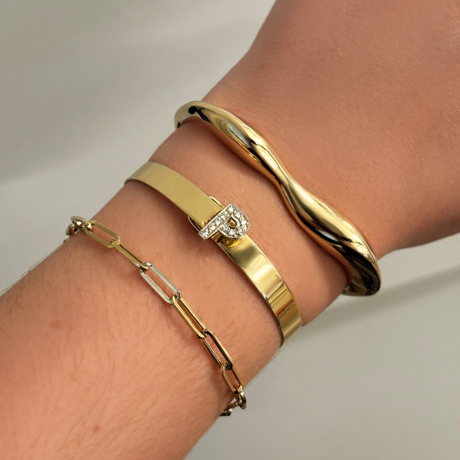 14k Molten Gold Cuff stacked with the Letter Cuff and Chunky Paperclip Chain Bracelet. 
